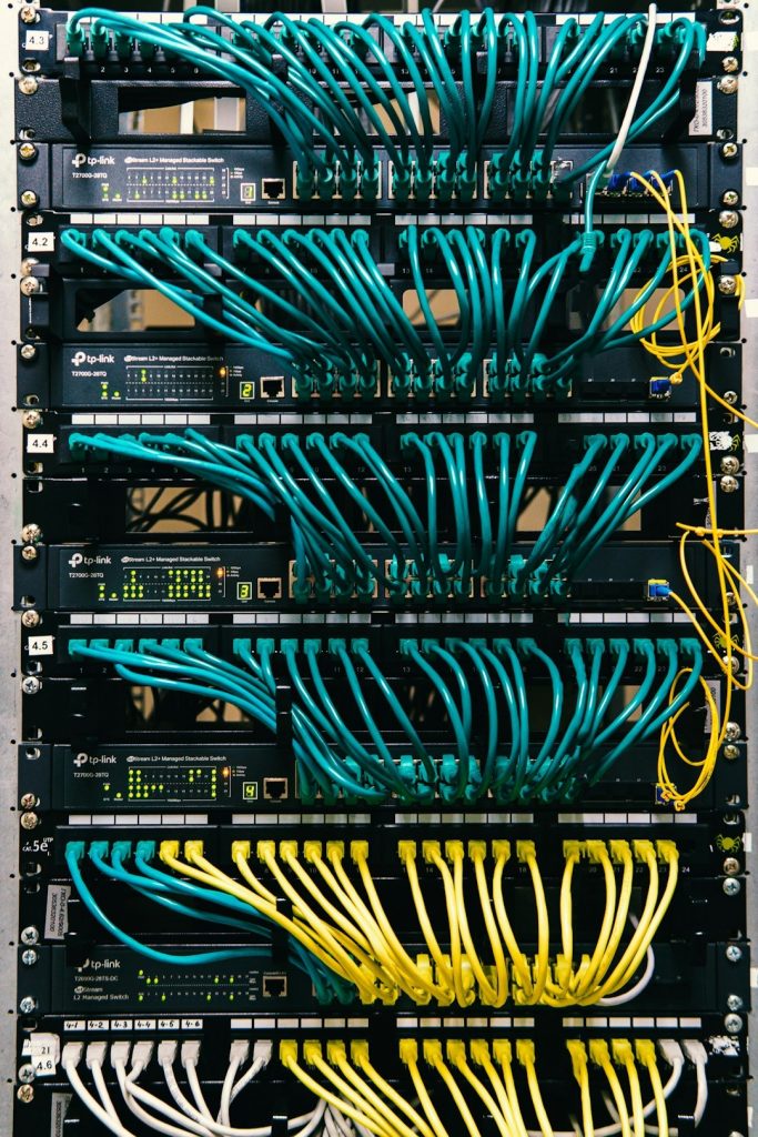 a rack of servers with wires and wires attached to them